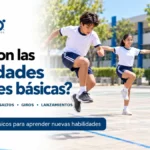 Estudiantes realizando habilidades motrices básicas como saltar, mantener el equilibrio y recibir una pelota, imagen del artículo «¿Qué son las habilidades motrices básicas?» de EF 360.